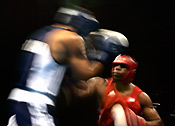 Odlanier Solis Fonte (red) of Cuba fights Saser Al Shami of Syria during the Athens 2004 Summer Olympics.